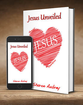 Picture of the Book Jesus Unveiled next to an iPhone with the image of the book's cover on the phone.